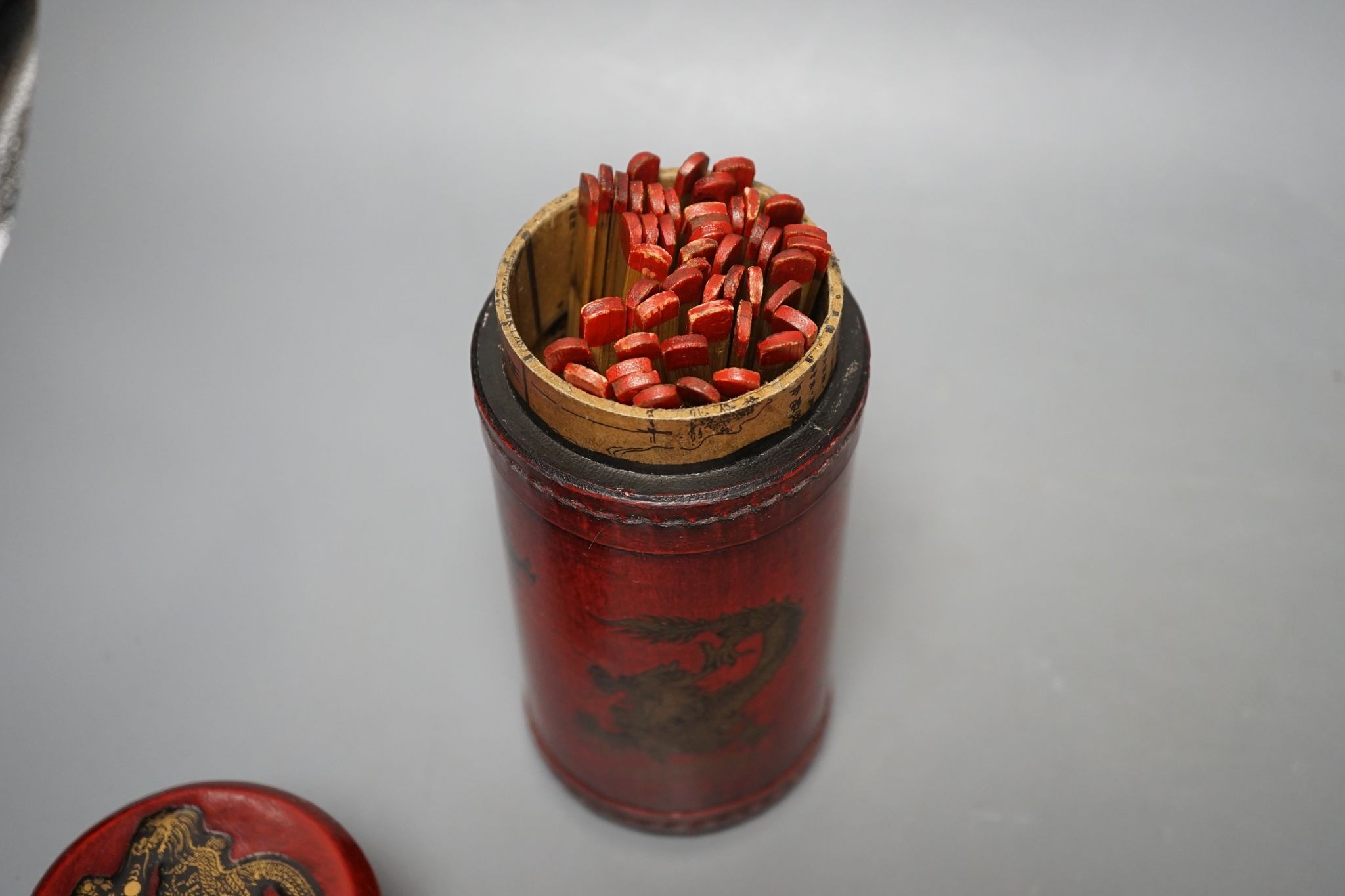 A pair of Chinese famille rose ‘peach’ bottle vases, 17cm, a ‘phoenix’ jar and cover, two porcelain cups and a boxed set of bamboo tallies or counters (6)